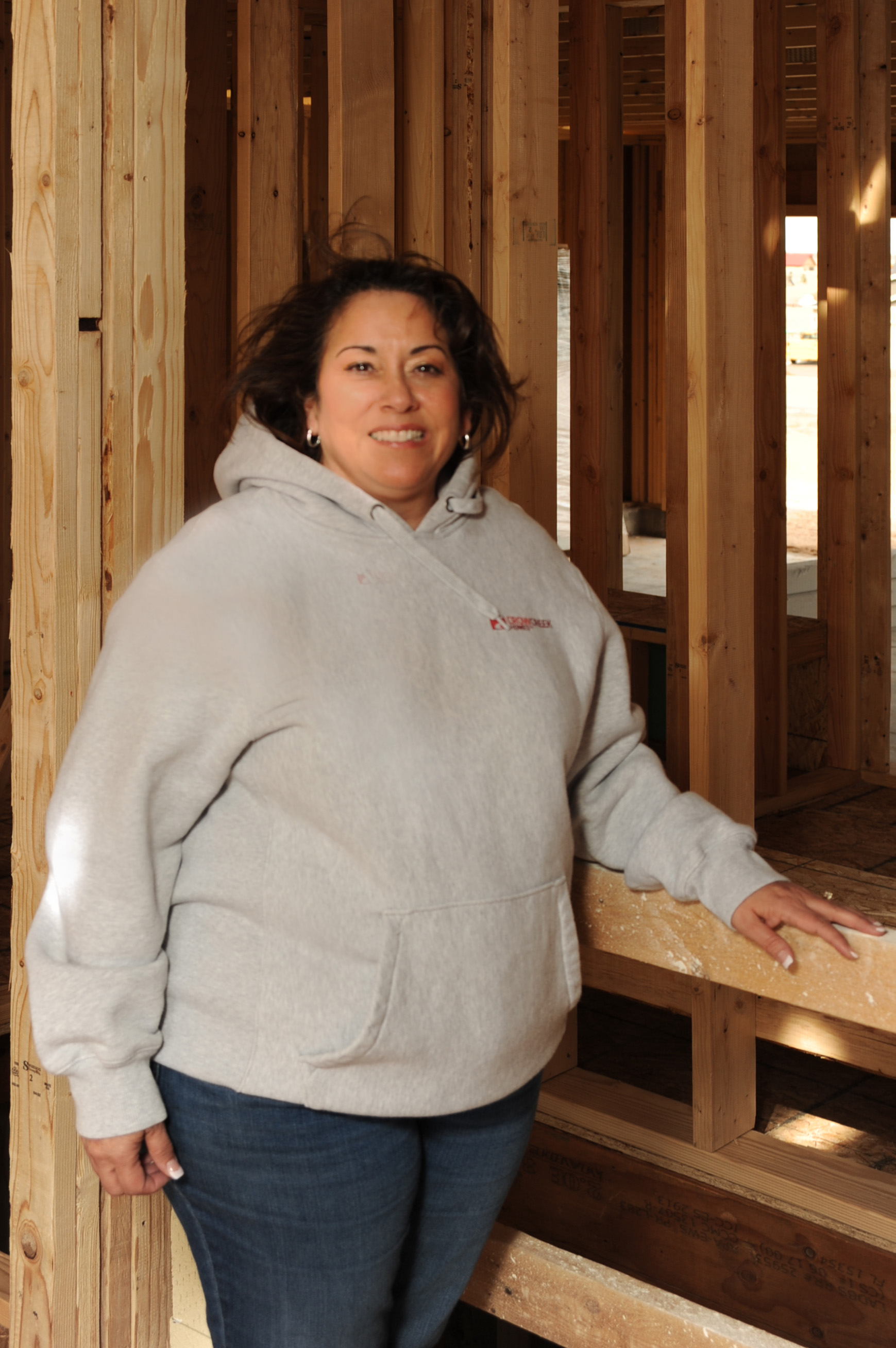Kim poses in home under construction