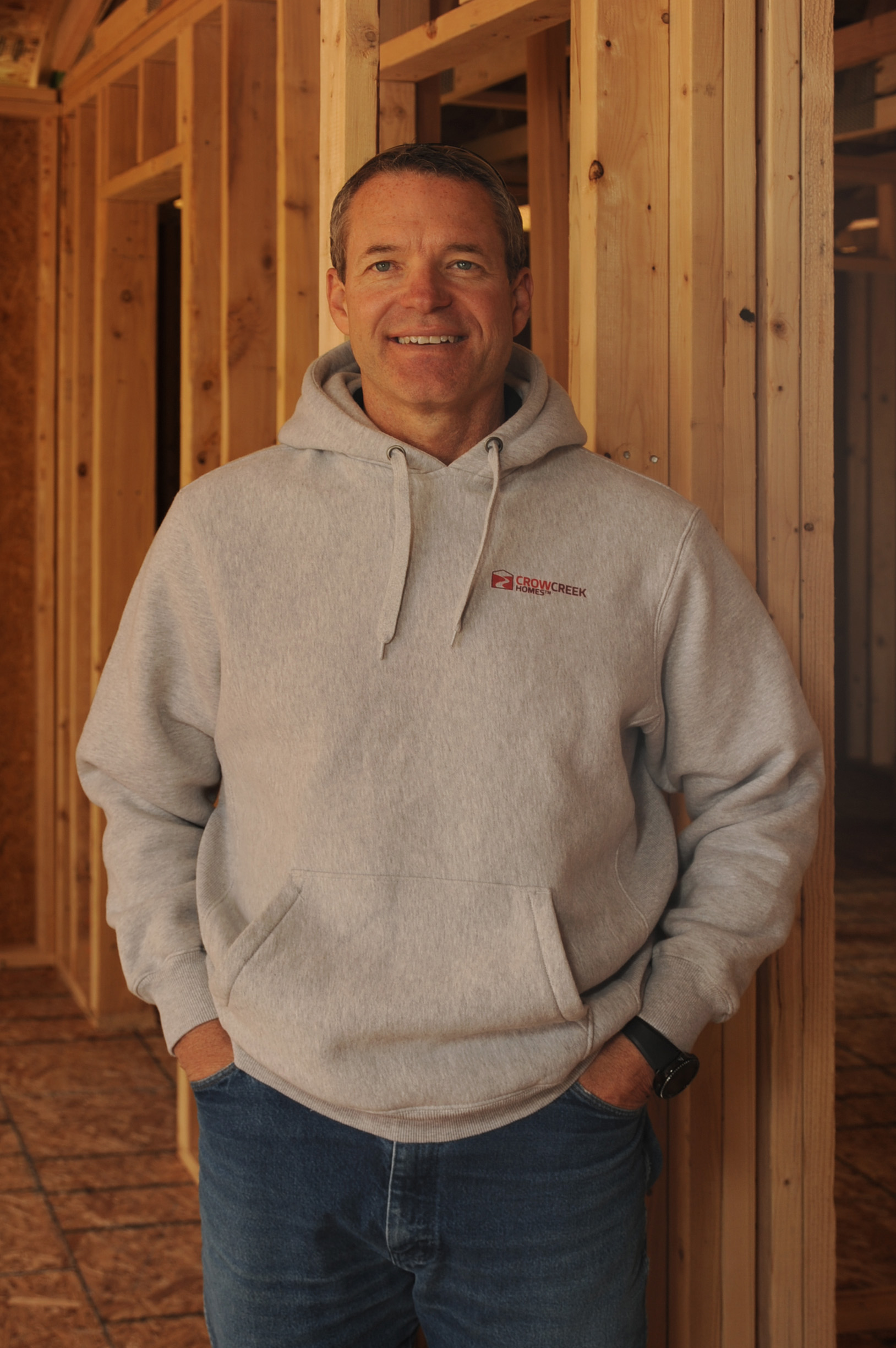 Tim poses in home under construction