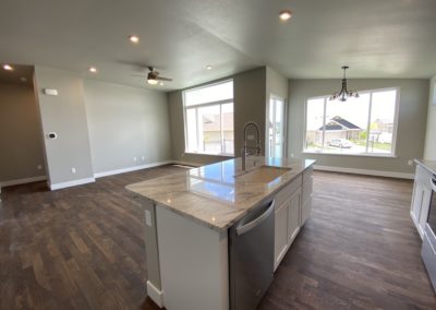 Wide view of the Brooke plan kitchen and living room